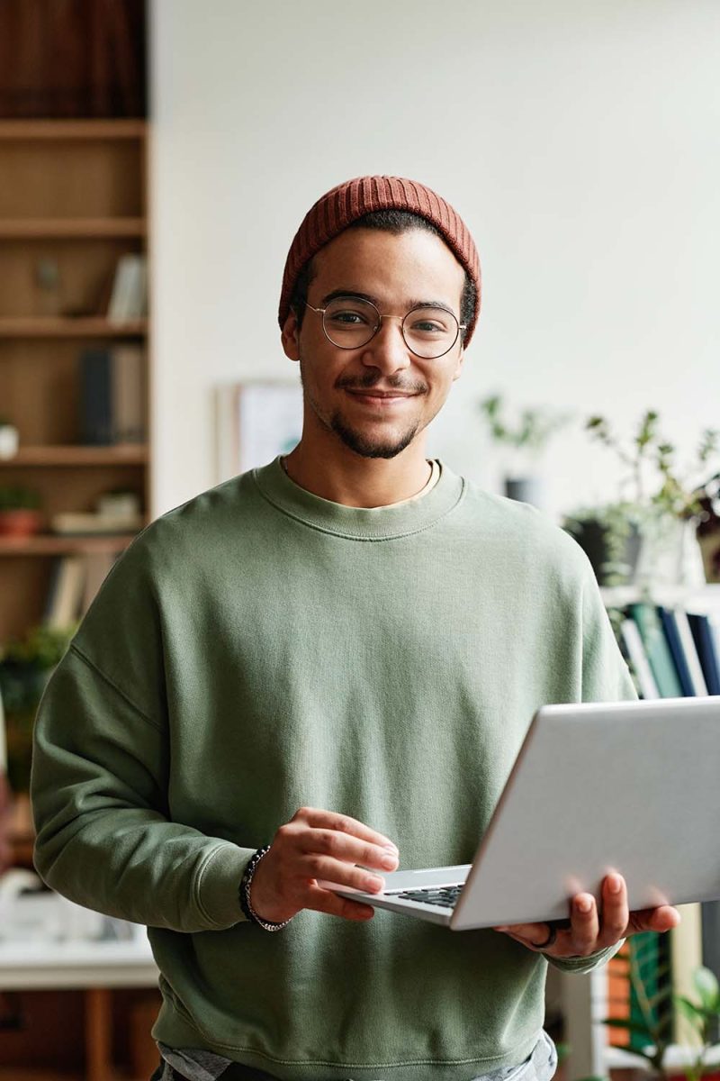 young-confident-it-engineer-in-casualwear-using-la-QTV32BB.jpg